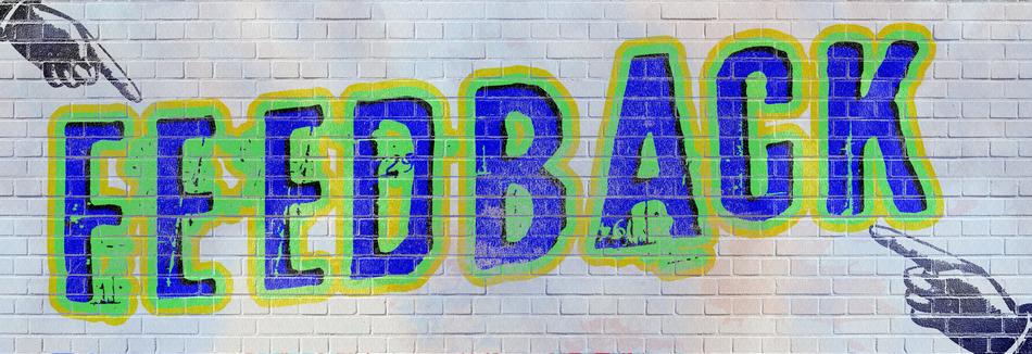 Colorful feedback graffiti on the white wall