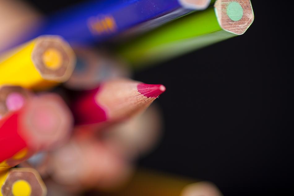 Colorful pencils at blurred background