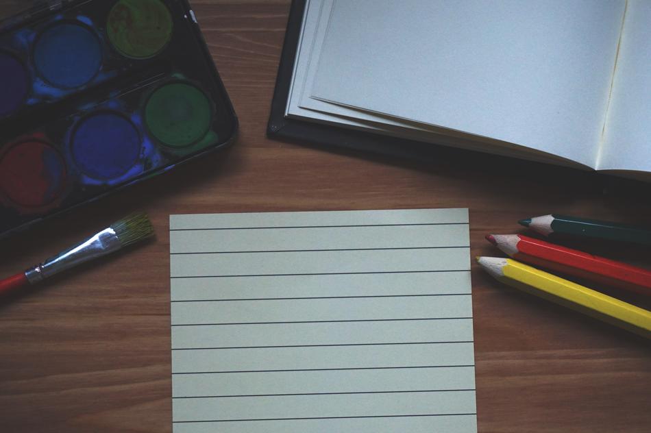 Paint Notebook Brush supplies on desk
