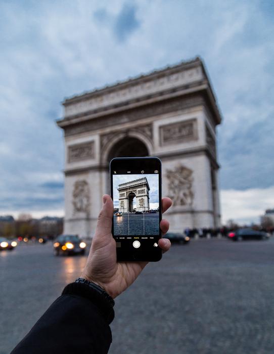 person Photographing Arc De Triomph with smartphone, france, Paris