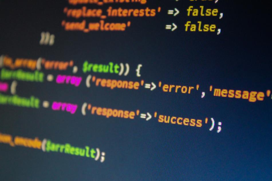 Colorful code commands on black background