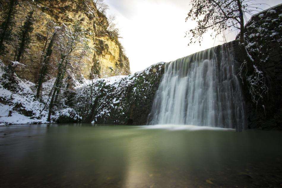 scenic waterfall in canyon at winter
