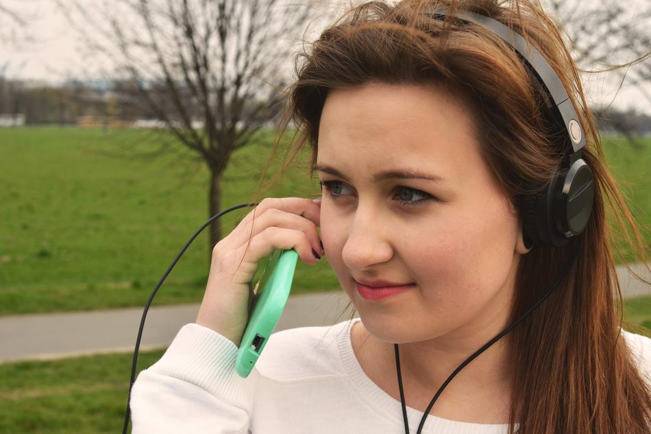 Girl with smartphone on street
