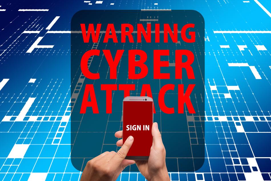 'Warning Cyber Attack sign' and phone in the hands, on clipart