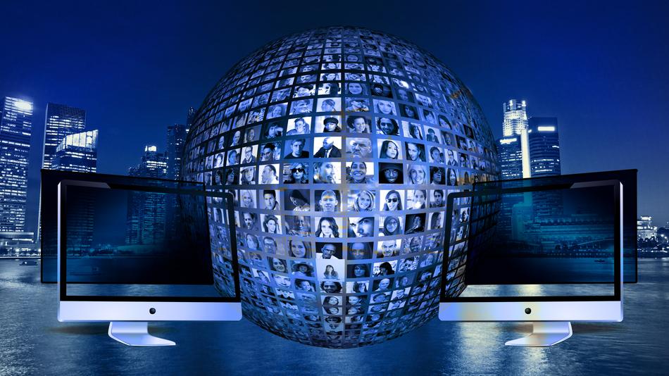 Monitors and portraits of the people, on the globe at background with the city