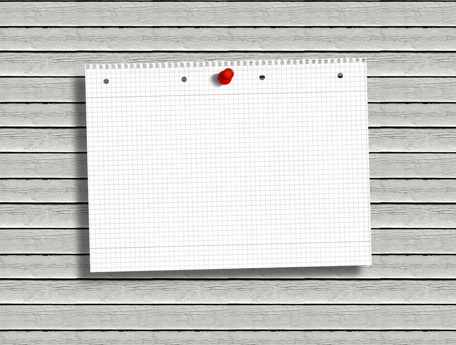 Checkered paper on a red pink, on a pink board, in light