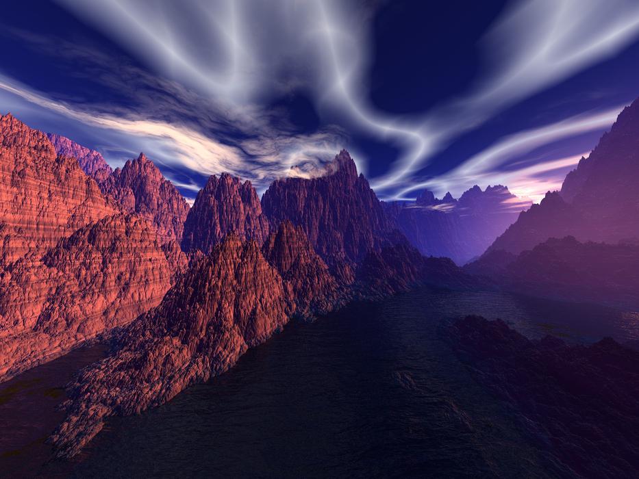 mountains in the desert against the backdrop of the sunset