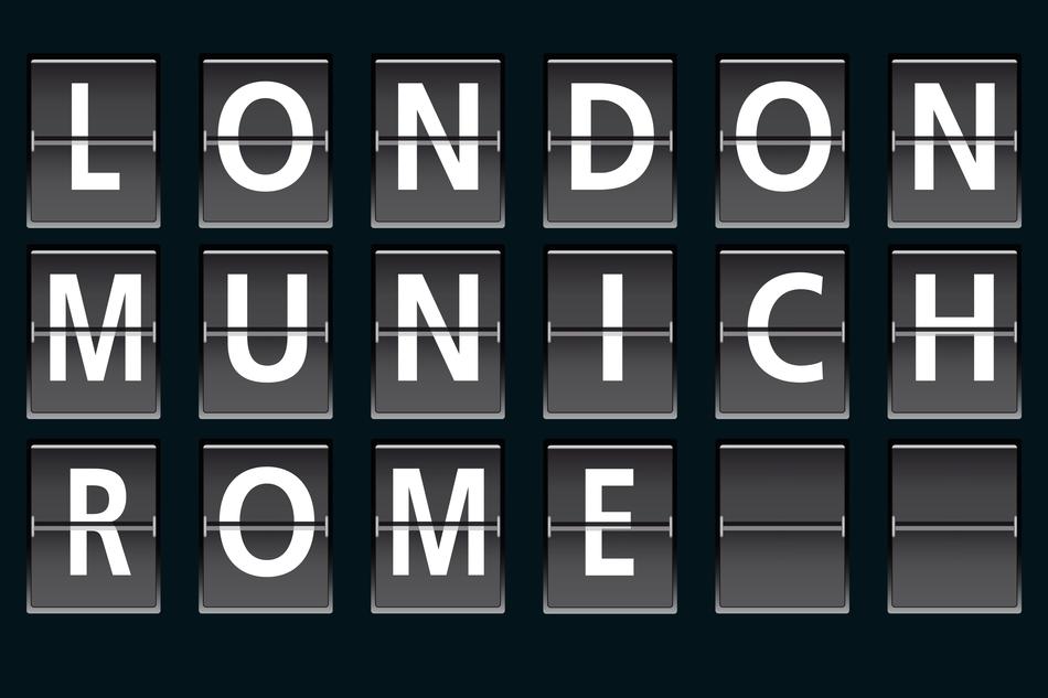 White 'London, Munich and Rome' signs, on the black board in airport
