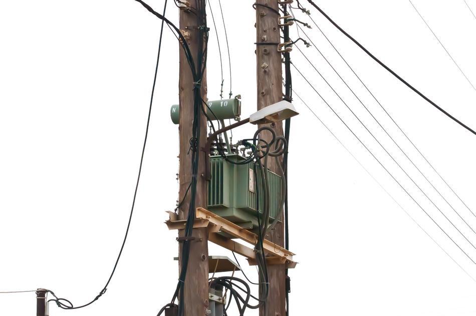 Close-up of the telephone cable, at white sky on background