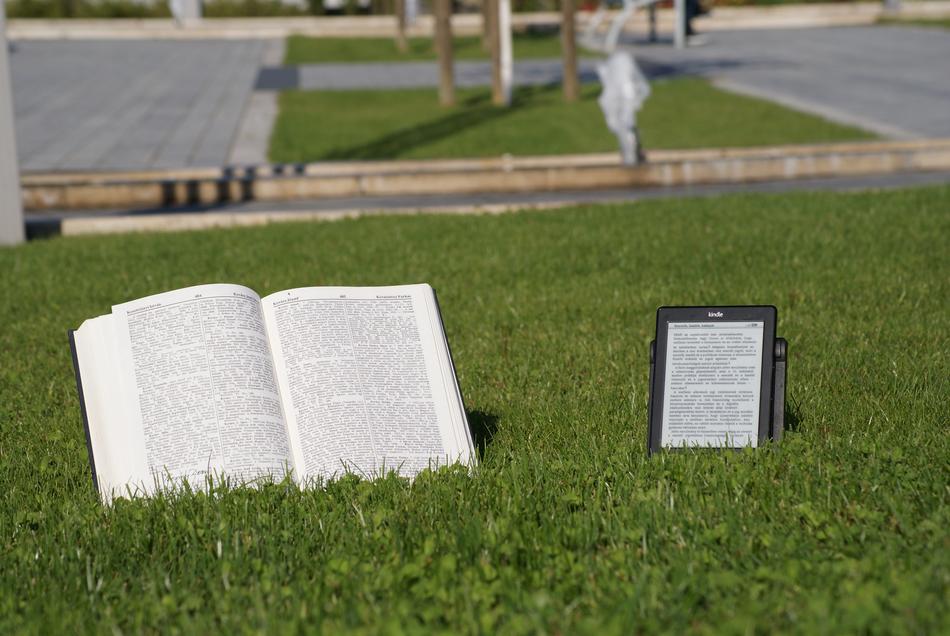 paper book and Ebook on lawn