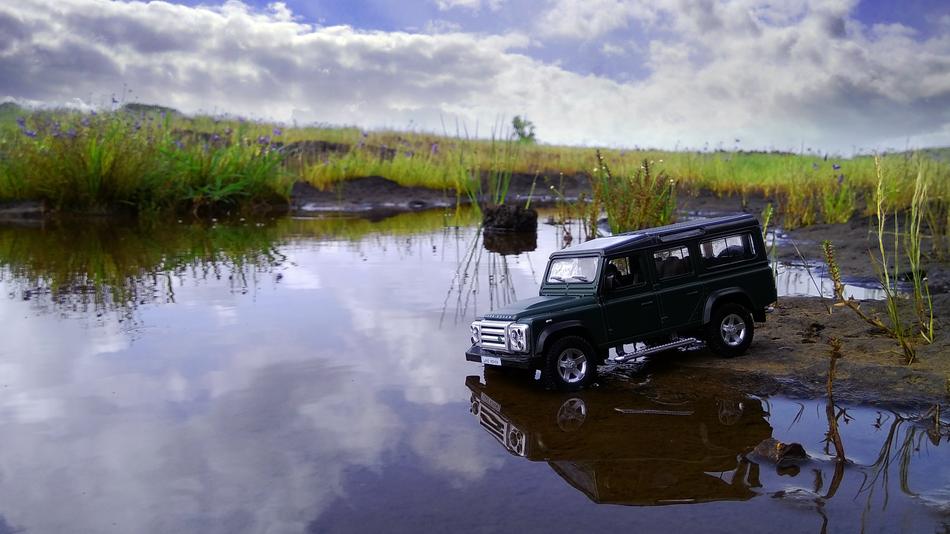 black car on the river bank in digital photography