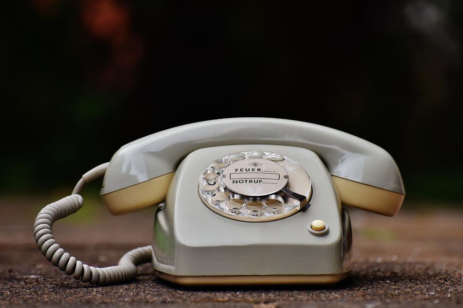 old gray phone close up on blurred background