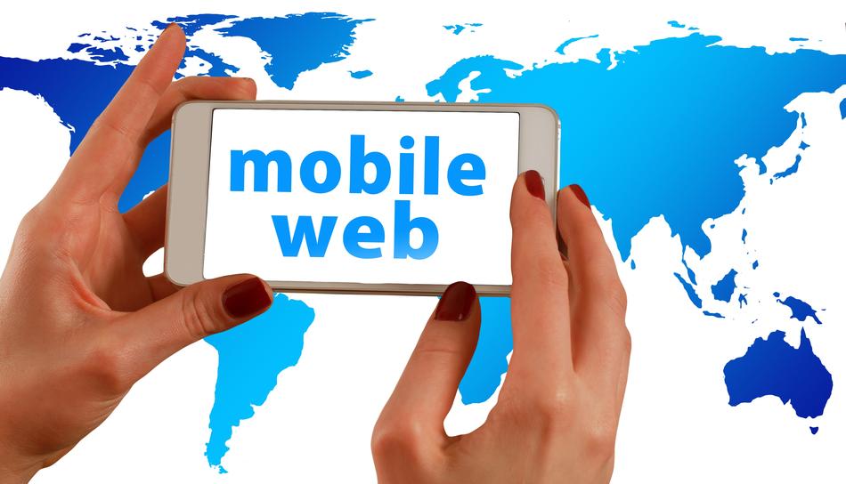 Clipart of the white smartphone with 'mobile web' in hands at background with blue and white map