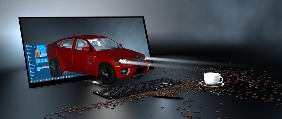 red car near computer monitor
