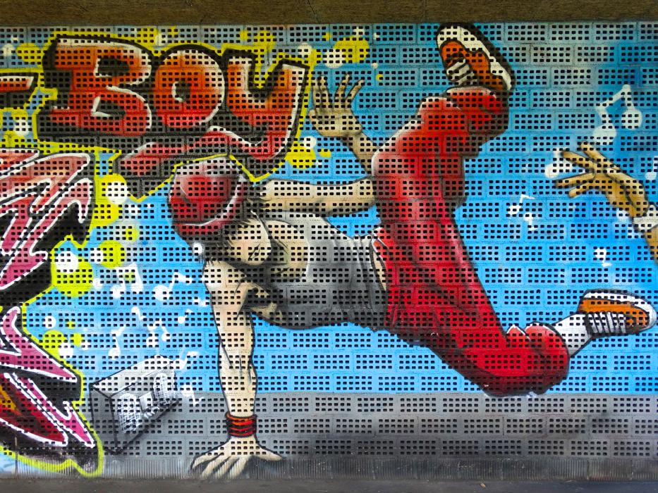 guy dancing break painted on the wall