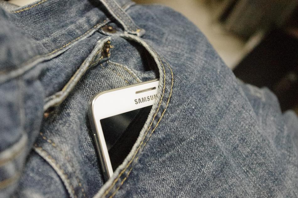 samsung smartphone in jeans pocket