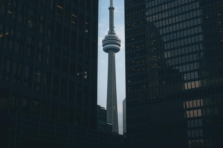 Television Tower between skyscrapers at evening