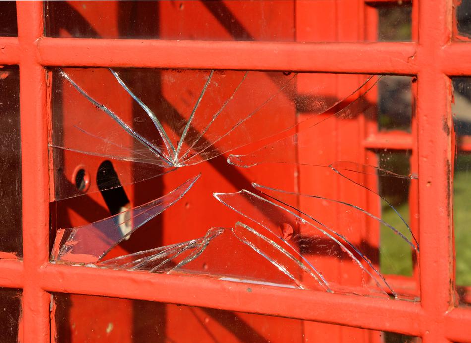 Broken Glass on red fence