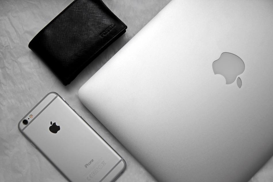 Close-up of the beautiful, shiny Iphone, Macbook and black cover
