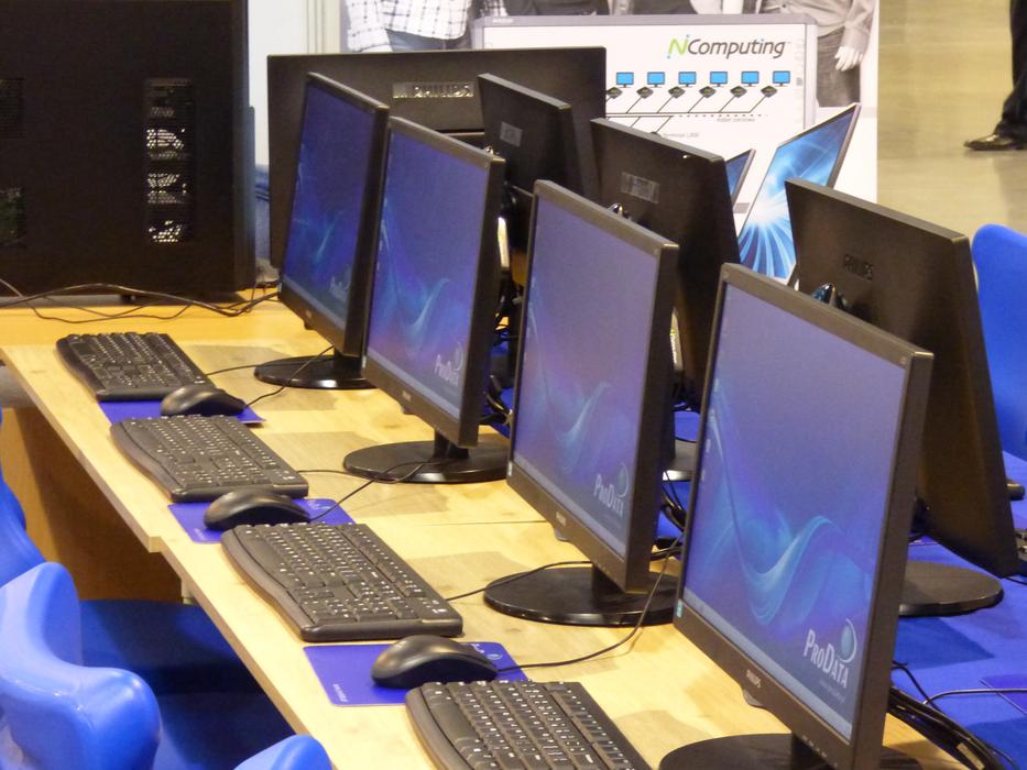 computers on tables in a row in the laboratory