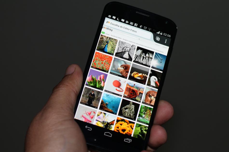 phone with colorful pictures in hand