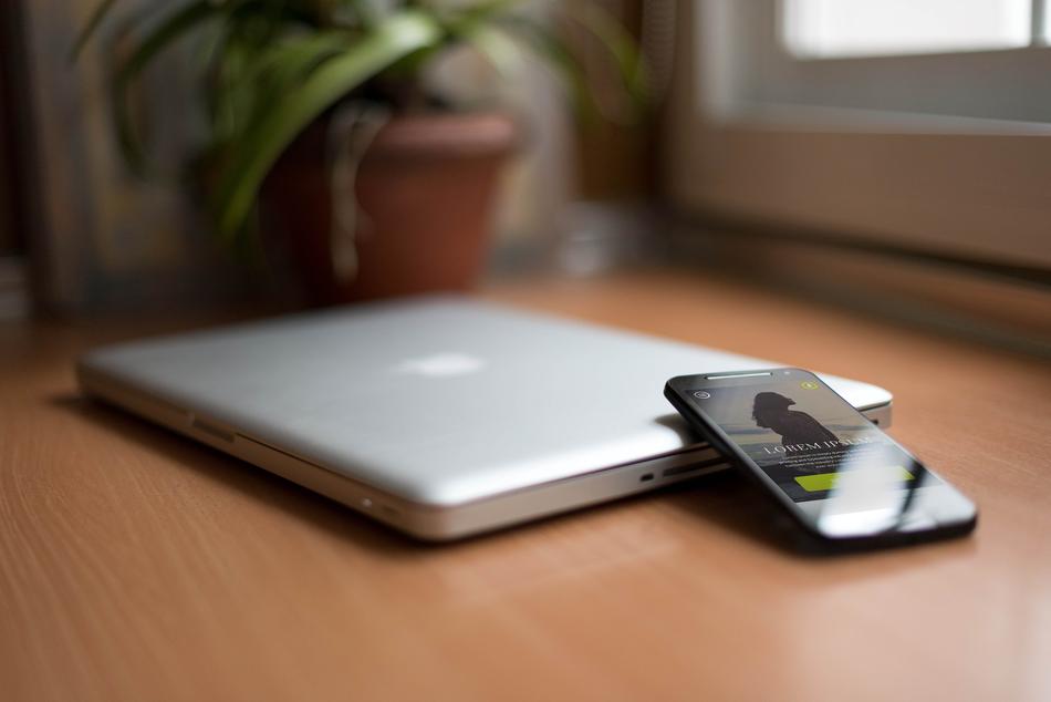 tablet and phone on table in blurred background