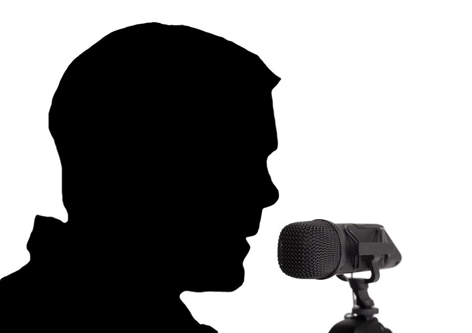 Silhouette of the profile portrait of a man, with the microphone, at white background, clipart