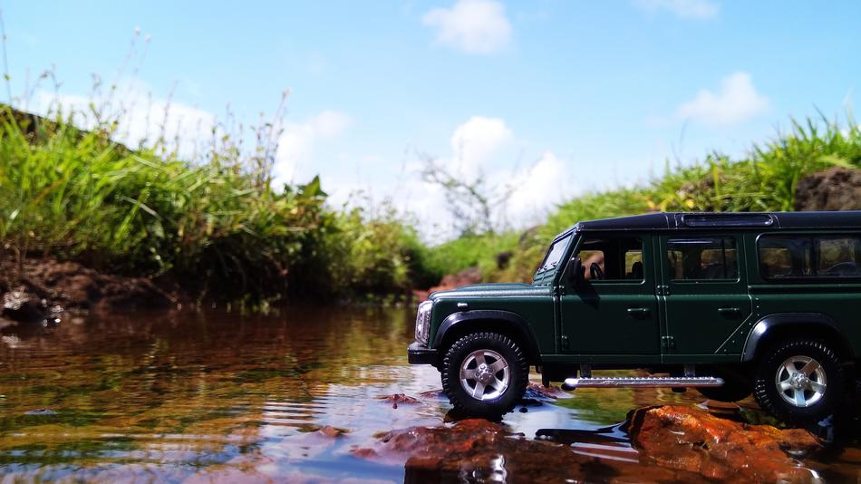 creative photo of a car on the river bank