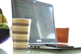 coffee in a mug near the laptop