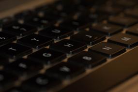 Laptop Computer Keyboard, black keys with white letters