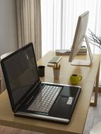 notebook ,cup ,computer o, table