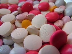 Close-up of the pile of colorful tablets with signs