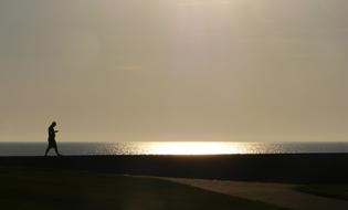 distant view of a man on the north sea coast