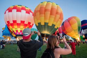 a crowd of people at the hot air balloon festival