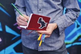 notebook in hands