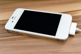 white Iphone 4S on the table