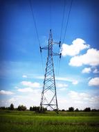 Power Electricity Line across a field on a summer day