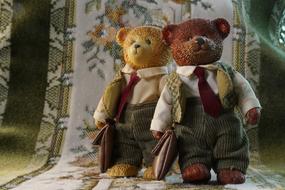 Two funny vintage toys, teddy Bears in tie suits