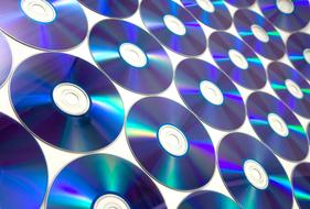 Shiny, colorful dvd discs, on the white surface