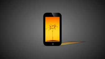 mobile phone with yellow screen on gray background