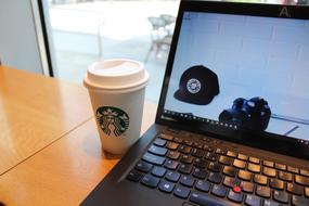 Coffee and Laptop Keyboard at cafe