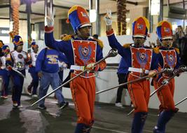 People in colorful costumes, on the Mardi Gras parade in New Orleans, USA