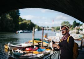 Man with Phone near water channel