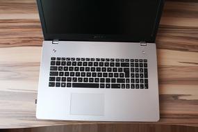 laptop keyboard on desk in office