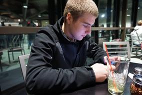 Young Man Teenage at Cafe