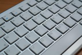 Close-up of the grey computer keyboard of different shades