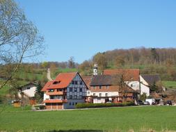 Landscape of the beautiful and colorful Unterwilzingen, Germany, on the green meadow among the plants, under the blue sky