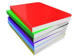 a stack of colored notebooks