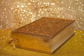 religious book on the glittering background