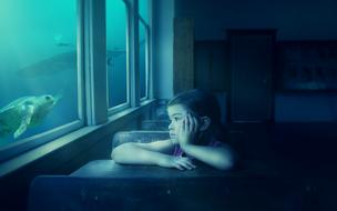 mystical photo of a girl at her desk looking into the aquarium
